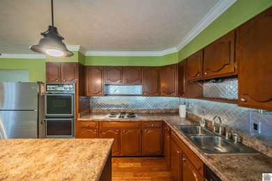 Two bedroom, 1.5-bath brick home offering 1,680 sq ft of on Calvert City Golf and Country Club in Kentucky - for sale on GolfHomes.com, golf home, golf lot