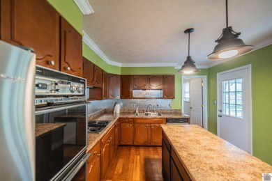 Two bedroom, 1.5-bath brick home offering 1,680 sq ft of on Calvert City Golf and Country Club in Kentucky - for sale on GolfHomes.com, golf home, golf lot