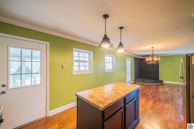 Two bedroom, 1.5-bath brick home offering 1,680 sq ft of on Calvert City Golf and Country Club in Kentucky - for sale on GolfHomes.com, golf home, golf lot