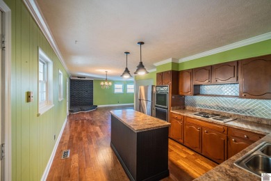 Two bedroom, 1.5-bath brick home offering 1,680 sq ft of on Calvert City Golf and Country Club in Kentucky - for sale on GolfHomes.com, golf home, golf lot
