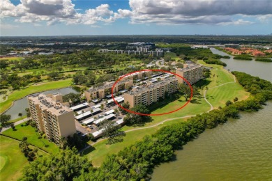 Golf Course. Inside, the living room opens to wide-open water on Cove Cay Country Club in Florida - for sale on GolfHomes.com, golf home, golf lot