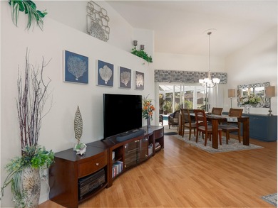 Discover Florida living in this immaculately maintained heated on Rotonda Golf and Country Club The Palms Course in Florida - for sale on GolfHomes.com, golf home, golf lot