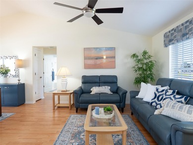 Discover Florida living in this immaculately maintained heated on Rotonda Golf and Country Club The Palms Course in Florida - for sale on GolfHomes.com, golf home, golf lot