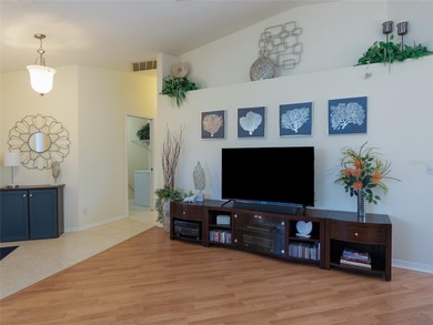 Discover Florida living in this immaculately maintained heated on Rotonda Golf and Country Club The Palms Course in Florida - for sale on GolfHomes.com, golf home, golf lot