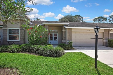Welcome to this bright and spacious Oakmont villa located in the on Timber Pines Golf Course in Florida - for sale on GolfHomes.com, golf home, golf lot