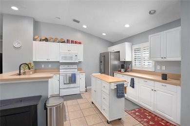 Welcome to this beautifully maintained waterfront home in on Palmetto-Pine Country Club in Florida - for sale on GolfHomes.com, golf home, golf lot