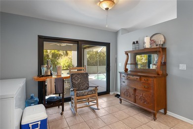 Welcome to this beautifully maintained waterfront home in on Palmetto-Pine Country Club in Florida - for sale on GolfHomes.com, golf home, golf lot