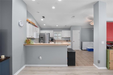 Welcome to this beautifully maintained waterfront home in on Palmetto-Pine Country Club in Florida - for sale on GolfHomes.com, golf home, golf lot