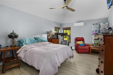 Welcome to this beautifully maintained waterfront home in on Palmetto-Pine Country Club in Florida - for sale on GolfHomes.com, golf home, golf lot