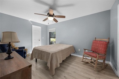 Welcome to this beautifully maintained waterfront home in on Palmetto-Pine Country Club in Florida - for sale on GolfHomes.com, golf home, golf lot