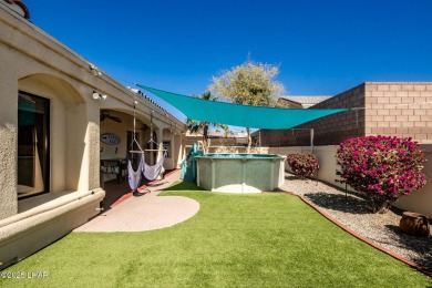 Situated in a peaceful cul-de-sac, this stunning 3-bedroom on London Bridge Golf Course in Arizona - for sale on GolfHomes.com, golf home, golf lot