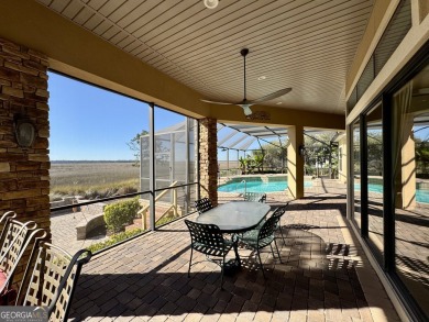 Enjoy breathtaking marsh views from this stunning custom-built on The Club At Osprey Cove in Georgia - for sale on GolfHomes.com, golf home, golf lot