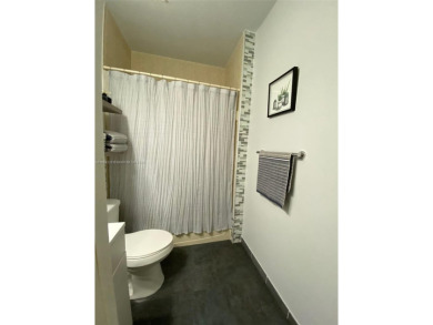 Beautiful and remodeled townhouse with 4 bedrooms and 3 full on Country Club of Miami in Florida - for sale on GolfHomes.com, golf home, golf lot