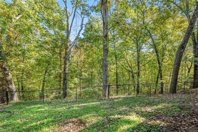 Exceptional location! This charming home backs up to Rago Trail on Bella Vista - Metfield Golf Complex and Country Club in Arkansas - for sale on GolfHomes.com, golf home, golf lot