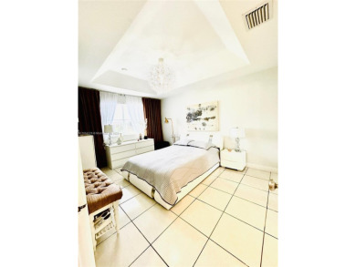 Beautiful and remodeled townhouse with 4 bedrooms and 3 full on Country Club of Miami in Florida - for sale on GolfHomes.com, golf home, golf lot