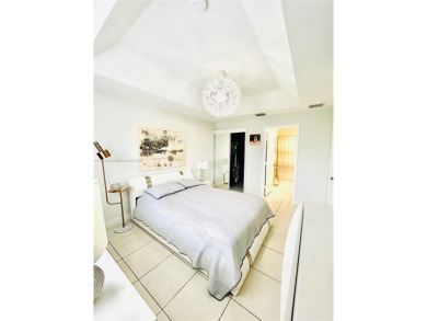 Beautiful and remodeled townhouse with 4 bedrooms and 3 full on Country Club of Miami in Florida - for sale on GolfHomes.com, golf home, golf lot