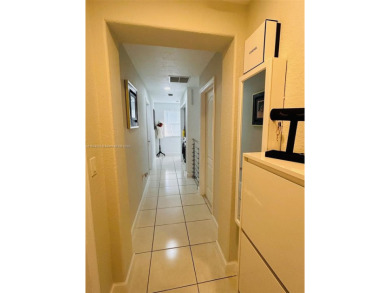 Beautiful and remodeled townhouse with 4 bedrooms and 3 full on Country Club of Miami in Florida - for sale on GolfHomes.com, golf home, golf lot