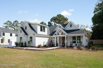 Welcome to your ideal coastal retreat! This beautiful 1.5 story on Crow Creek Golf Club in North Carolina - for sale on GolfHomes.com, golf home, golf lot
