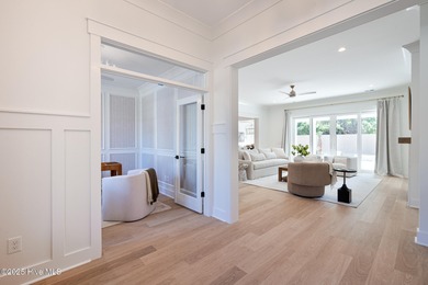 Welcome to your ideal coastal retreat! This beautiful 1.5 story on Crow Creek Golf Club in North Carolina - for sale on GolfHomes.com, golf home, golf lot