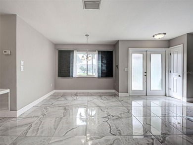 One or more photo(s) has been virtually staged. A Must See! This on Sarasota National Golf Club in Florida - for sale on GolfHomes.com, golf home, golf lot