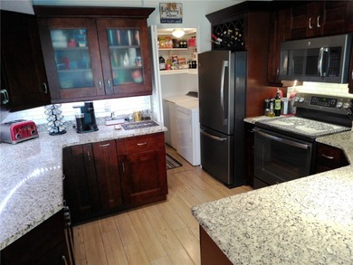 This is a BEAUTIFULLY appointed Condo in a well sought location on East Bay Golf Club in Florida - for sale on GolfHomes.com, golf home, golf lot