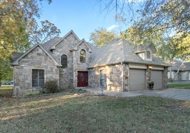 This beautiful stone home sits on the 18th Fairway in The Coves on The Coves Golf Course in Oklahoma - for sale on GolfHomes.com, golf home, golf lot