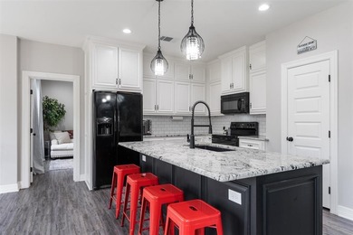 Colonial house adjacent to the golf course with lake view and on Cedar Creek Country Club in Texas - for sale on GolfHomes.com, golf home, golf lot