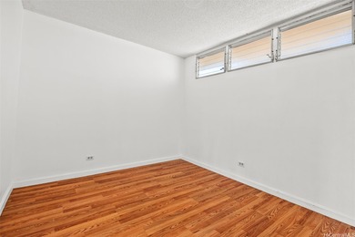 Enjoy golf course views from this centrally located 2-bedroom on Honolulu Country Club in Hawaii - for sale on GolfHomes.com, golf home, golf lot