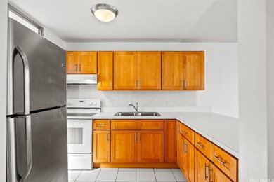 Enjoy golf course views from this centrally located 2-bedroom on Honolulu Country Club in Hawaii - for sale on GolfHomes.com, golf home, golf lot