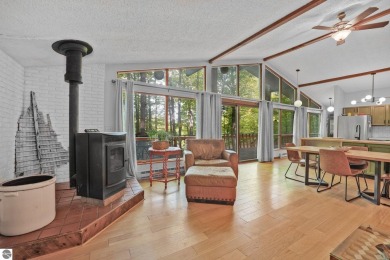 Anchor your Northern Michigan adventures at this architecturally on The Chief Golf Course in Michigan - for sale on GolfHomes.com, golf home, golf lot