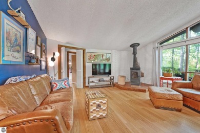Anchor your Northern Michigan adventures at this architecturally on The Chief Golf Course in Michigan - for sale on GolfHomes.com, golf home, golf lot