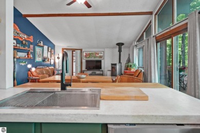 Anchor your Northern Michigan adventures at this architecturally on The Chief Golf Course in Michigan - for sale on GolfHomes.com, golf home, golf lot