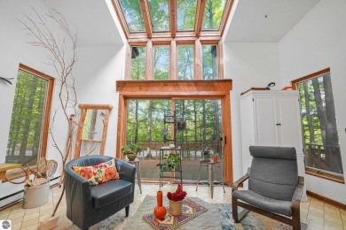 Anchor your Northern Michigan adventures at this architecturally on The Chief Golf Course in Michigan - for sale on GolfHomes.com, golf home, golf lot
