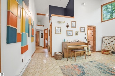 Anchor your Northern Michigan adventures at this architecturally on The Chief Golf Course in Michigan - for sale on GolfHomes.com, golf home, golf lot
