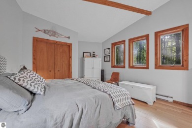 Anchor your Northern Michigan adventures at this architecturally on The Chief Golf Course in Michigan - for sale on GolfHomes.com, golf home, golf lot