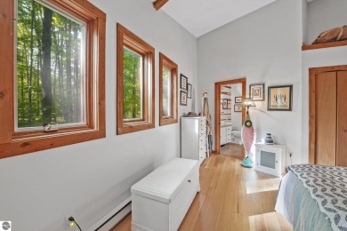 Anchor your Northern Michigan adventures at this architecturally on The Chief Golf Course in Michigan - for sale on GolfHomes.com, golf home, golf lot