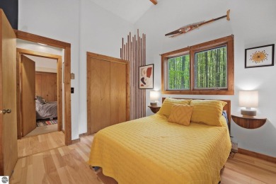 Anchor your Northern Michigan adventures at this architecturally on The Chief Golf Course in Michigan - for sale on GolfHomes.com, golf home, golf lot