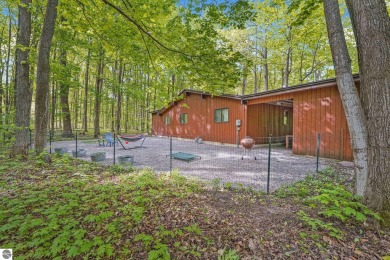 Anchor your Northern Michigan adventures at this architecturally on The Chief Golf Course in Michigan - for sale on GolfHomes.com, golf home, golf lot