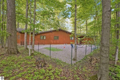Anchor your Northern Michigan adventures at this architecturally on The Chief Golf Course in Michigan - for sale on GolfHomes.com, golf home, golf lot