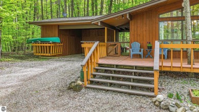 Anchor your Northern Michigan adventures at this architecturally on The Chief Golf Course in Michigan - for sale on GolfHomes.com, golf home, golf lot