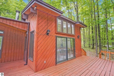 Anchor your Northern Michigan adventures at this architecturally on The Chief Golf Course in Michigan - for sale on GolfHomes.com, golf home, golf lot