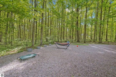 Anchor your Northern Michigan adventures at this architecturally on The Chief Golf Course in Michigan - for sale on GolfHomes.com, golf home, golf lot