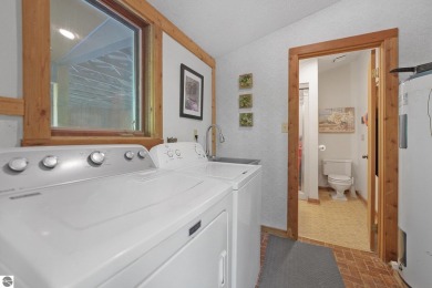 Anchor your Northern Michigan adventures at this architecturally on The Chief Golf Course in Michigan - for sale on GolfHomes.com, golf home, golf lot
