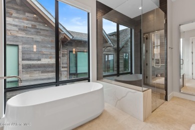 Welcome to this modern lakeview retreat, where thoughtful design on Gozzer Ranch Golf and Lake Club in Idaho - for sale on GolfHomes.com, golf home, golf lot