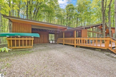 Anchor your Northern Michigan adventures at this architecturally on The Chief Golf Course in Michigan - for sale on GolfHomes.com, golf home, golf lot