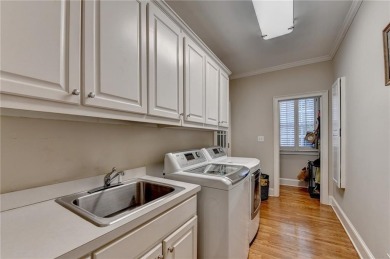 Presenting a traditional cedar shake Hamptons style home on St. Ives Golf and Country Club in Georgia - for sale on GolfHomes.com, golf home, golf lot