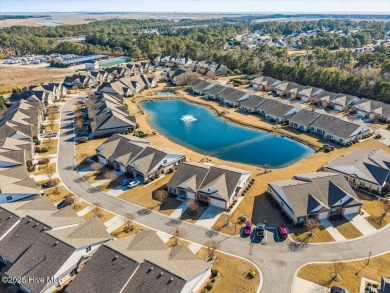 Experience the pleasures of coastal living in this charming on South Harbour Golf Links in North Carolina - for sale on GolfHomes.com, golf home, golf lot