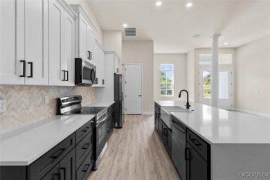This home offers modern elegance and the tranquility of golf on Southern Woods Golf Club in Florida - for sale on GolfHomes.com, golf home, golf lot