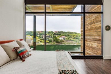 This home is open and bright, with floor-to-ceiling windows on Point Venture Golf Club on Lake Travis in Texas - for sale on GolfHomes.com, golf home, golf lot