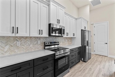 This home offers modern elegance and the tranquility of golf on Southern Woods Golf Club in Florida - for sale on GolfHomes.com, golf home, golf lot